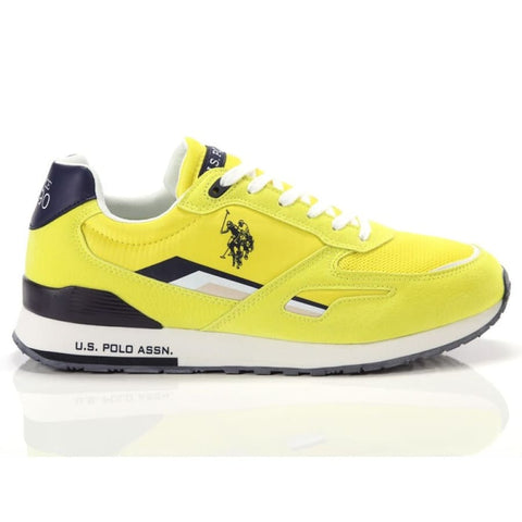 Close-up of men’s yellow black urban sneaker white sole