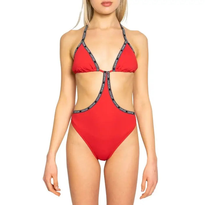 Woman in red bikini showcasing chic women’s beachwear styles