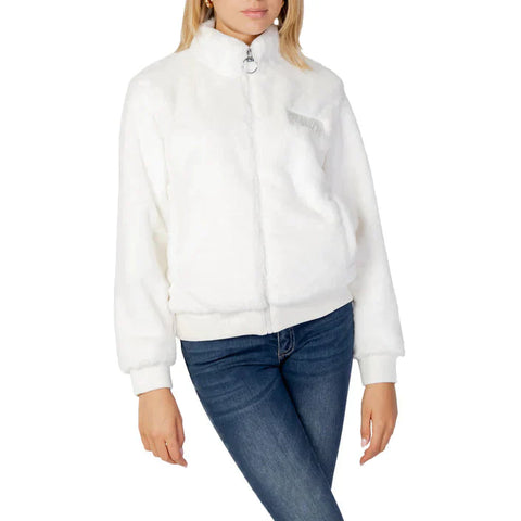 Woman in white jacket and jeans from our Women’s Jackets collection