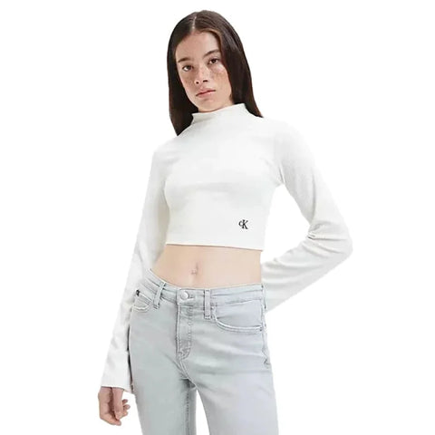 Woman in white crop top from Women’s Knitwear collection.