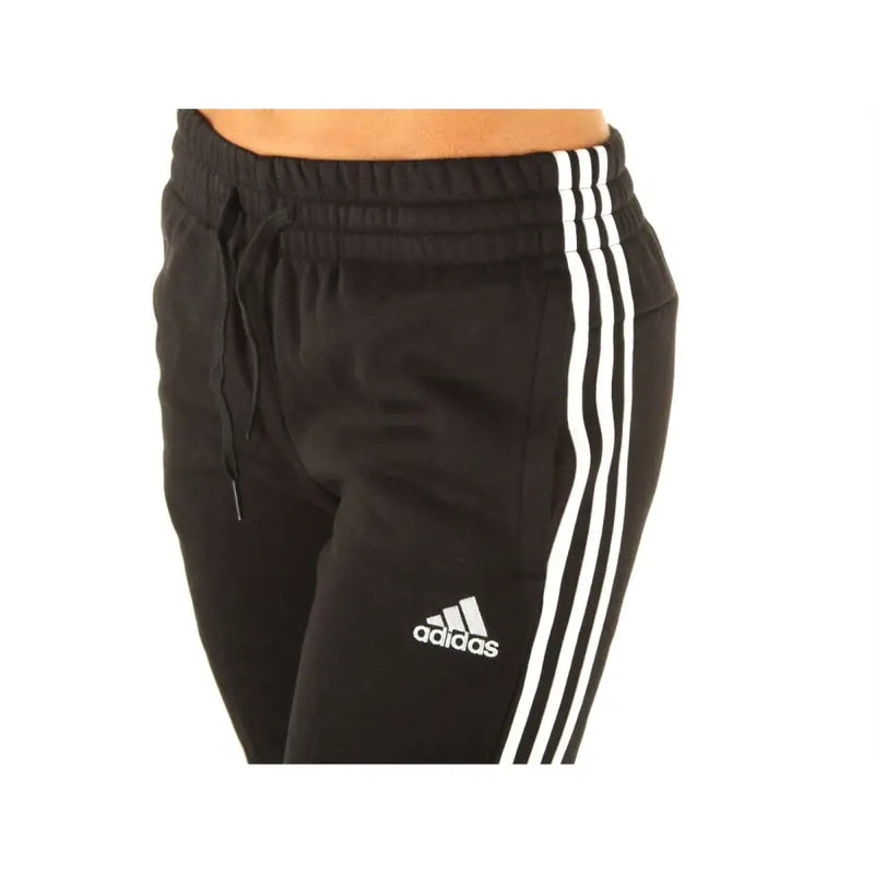 Adidas black sweatpants in soft fabric with three white side stripes and logo on the thigh for casual wear