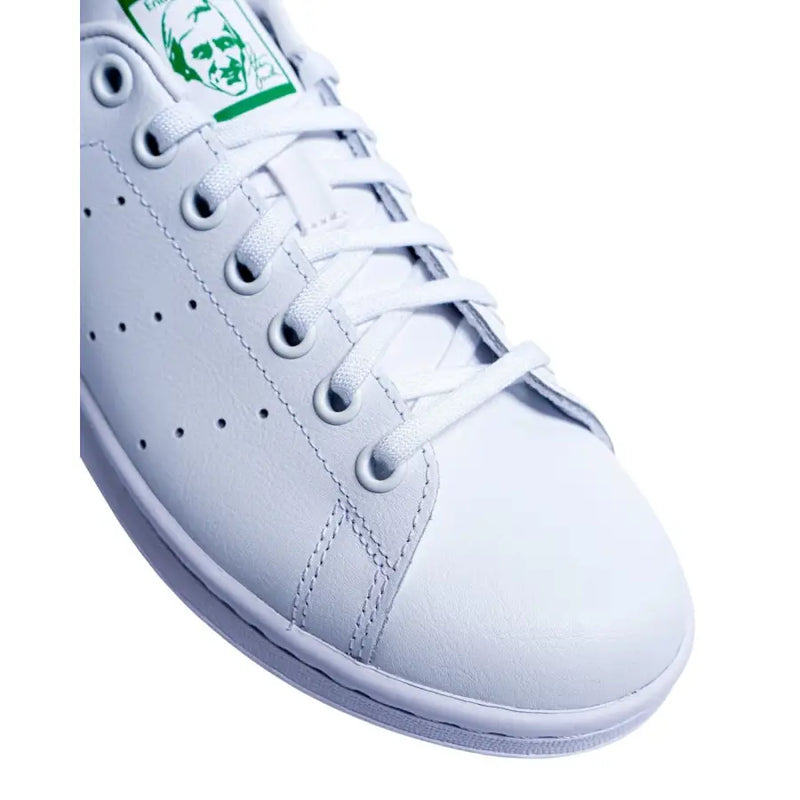 White leather adidas stan smith sneaker with green synthetic branding on the tongue for men model M20324 FX5502