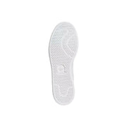 Back side of white adidas originals men sneakers green synthetic sole with honeycomb pattern and trefoil logo embossed