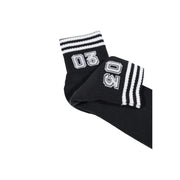 Chaussettes noires adidas Originals pour homme, style sous-vêtement, avec logo 03 ow brodé en blanc et trois bandes blanches sur le bord-côte.