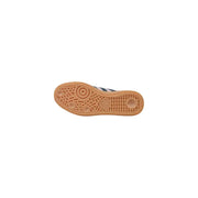 Back side of adidas women pink leather slip on sporty sneakers featuring a tan rubber sole with textured pattern and embossed logo