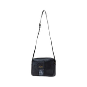 Black rectangular crossbody bag with zip closure and slim shoulder strap for women