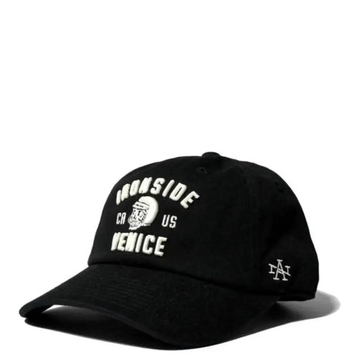 Black baseball cap with white text and logo, featuring a skull design.