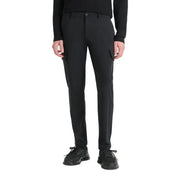 Men’s black slim fit cargo pants with side pockets paired with black athletic shoes