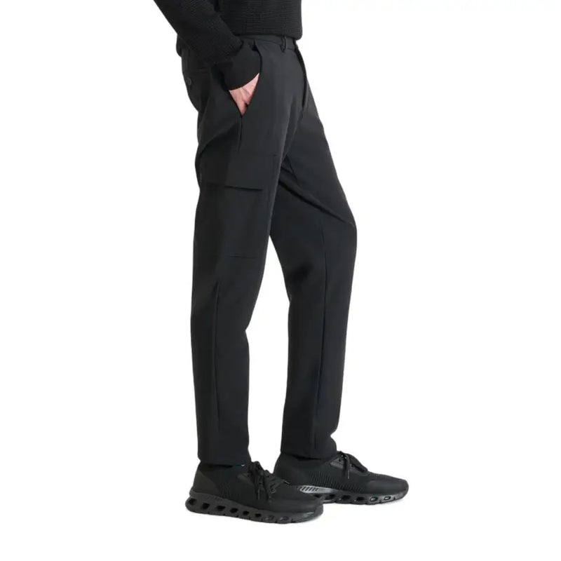 Men’s black trousers with unique flap pocket and black athletic sneakers for Antony Morato collection