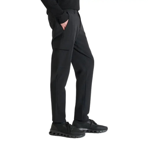 Men’s black trousers with unique flap pocket and black athletic sneakers for Antony Morato collection