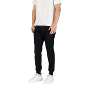 Men’s black tapered jogger pants with white t-shirt and sneakers from Antony Morato