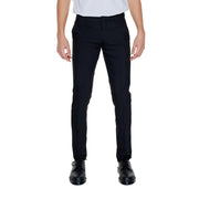Men’s slim-fit black dress pants with pressed creases and black lace-up shoes