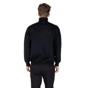 Black zip-up jacket with high collar and ribbed cuffs, likely made of polyester or cotton blend.