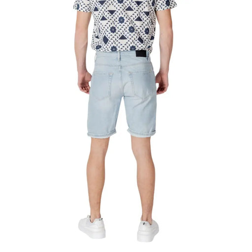 Light blue denim shorts with a classic five-pocket design and white stitching.