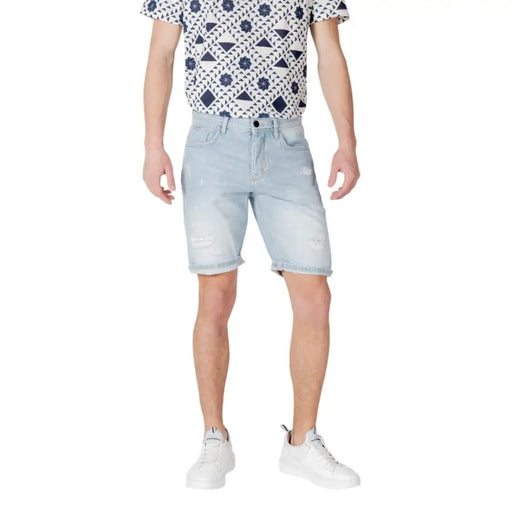 Antony Morato blue cotton shorts for men featuring light-wash denim with distressed patches and rolled cuffs