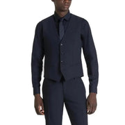 Navy blue wool three-piece suit with a vest, shirt and trousers.