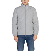 Light gray quilted puffer jacket with zipper and ribbed cuffs.