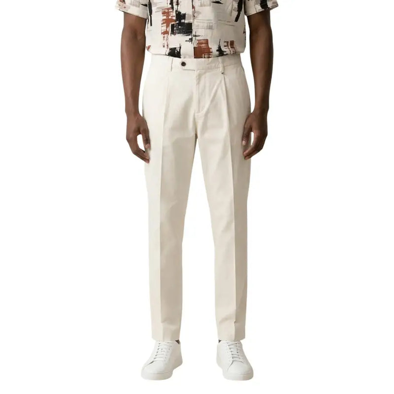 Antony Morato men black cotton linen trousers with tailored fit shown as cream-colored pleated chino trousers