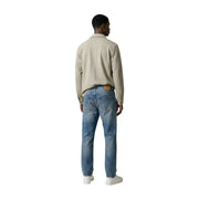 Beige cotton shirt with collar and long sleeves paired with blue denim jeans shown in Antony Morato Men blazer product
