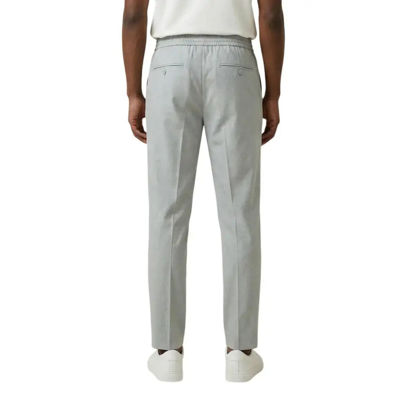 Antony Morato Graue Herrenhose aus Polyester-Viskose in schmaler Passform mit elastischem Bund und zwei Gesäßtaschen, von hinten gesehen