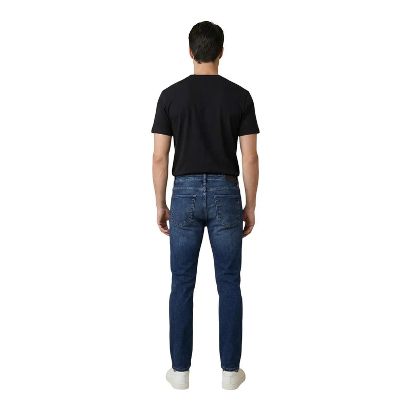 Antony morato men ozzy tapered fit blue cotton jeans shown from the back with dark blue slim fit denim and classic pockets