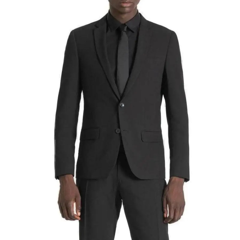 Men’s black suit featuring a two-button blazer and matching tie from Antony Morato Spring Summer collection