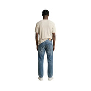 Antony morato men t-shirt paired with blue denim jeans featuring a classic five-pocket design and faded wash