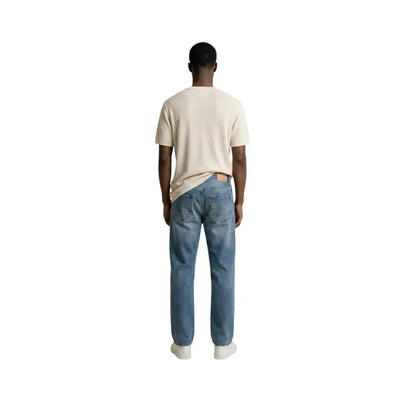 Antony morato men t-shirt paired with blue denim jeans featuring a classic five-pocket design and faded wash