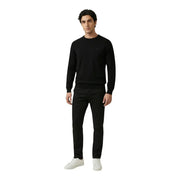Antony Morato men trousers paired with a black knit sweater featuring a subtle embroidered logo on the left chest