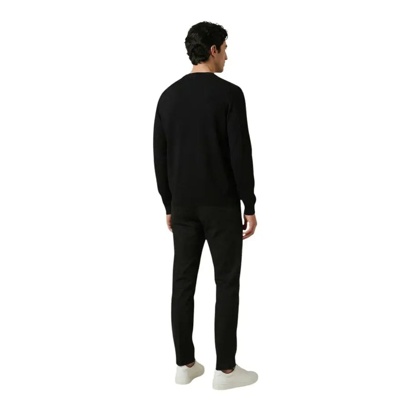 Antony Morato men trousers paired with a black crewneck sweater featuring long sleeves and a smooth fitted silhouette