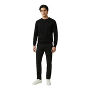 Antony Morato men trousers paired with a black knit sweater featuring a subtle embroidered logo on the left chest