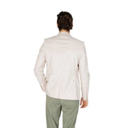 A man wearing an antony morato men white cotton blend blazer in cream with tailored fit and subtle stitching details