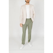 A man wearing an antony morato men white cotton modal blazer with long lapel in light beige over casual attire