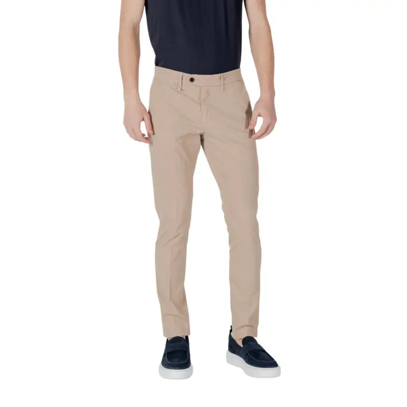 Men’s slim-fit khaki chinos with dark blue slip-on shoes from Antony Morato for spring summer