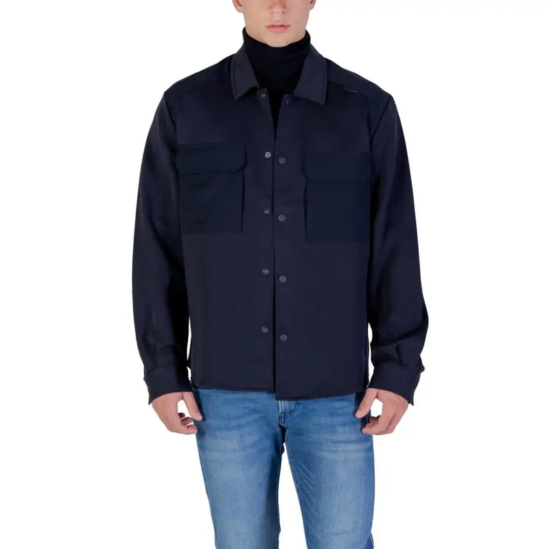 Men’s navy blue long-sleeved button-up shirt with chest pockets for fall winter fashion