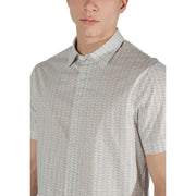 Light gray short-sleeved polo shirt with subtle repeating monogram pattern from armani exchange beige geometric collection