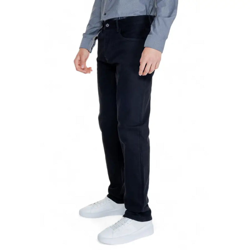 Men’s black regular-fit cotton blend trousers with button closure, paired with gray shirt and white sneakers