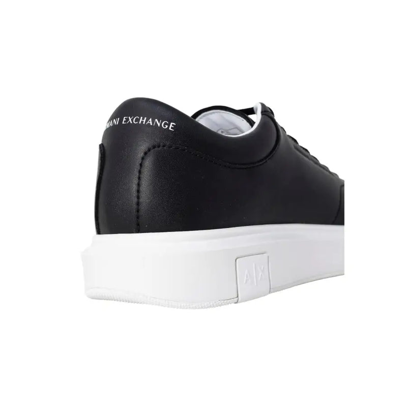 Back view of Armani Exchange black leather low-top sneakers for men with white rubber sole and branding on heel