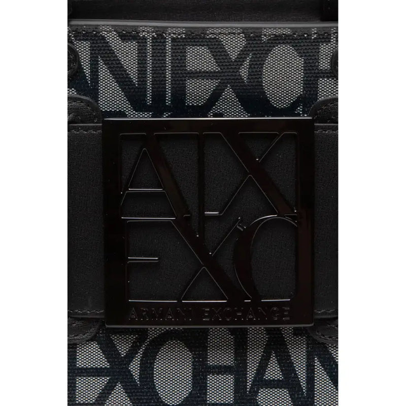 Black square metal plaque with embossed ax logo and armani exchange text on black print polyurethane handbag