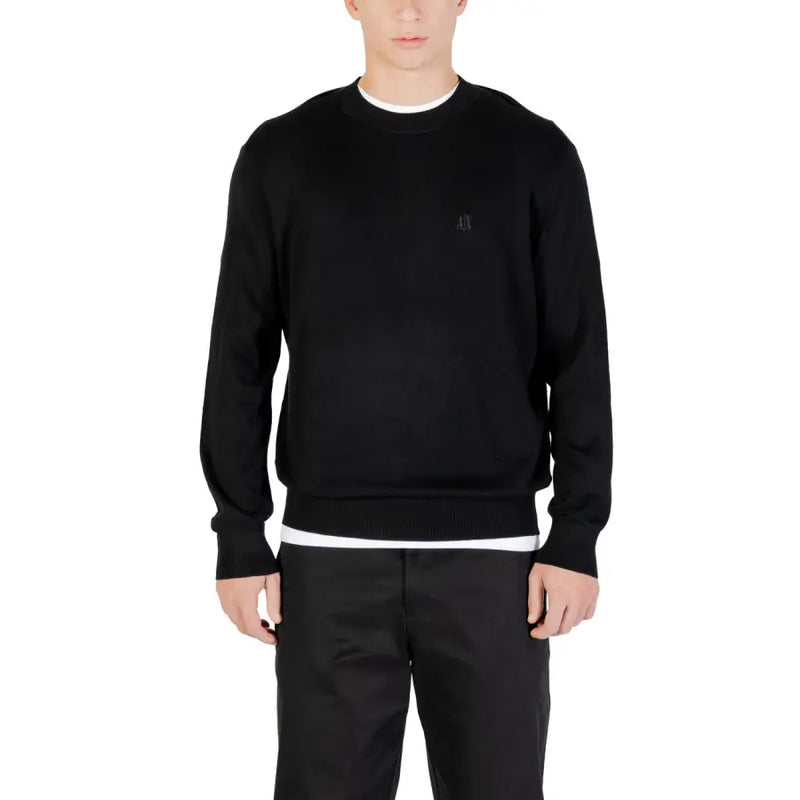 Black crewneck sweatshirt with white trim and logo on chest.