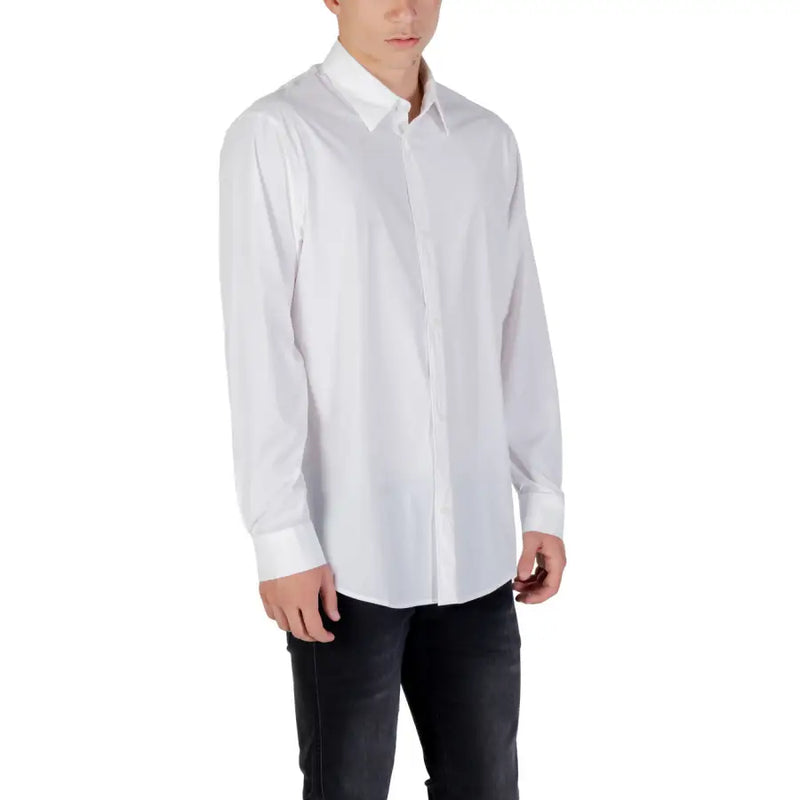 Armani Exchange classic white long sleeve men’s dress shirt with pointed collar and dark jeans