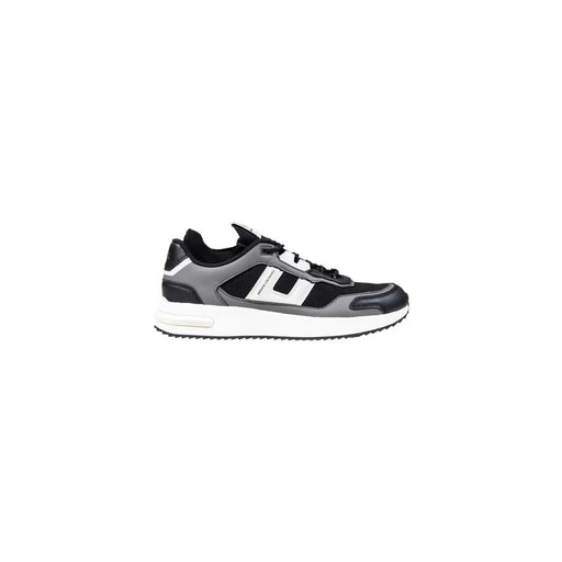 Black and white sneaker with a chunky sole, likely made of leather or synthetic material.