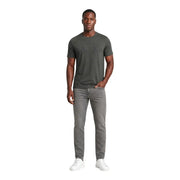 Armani exchange jeans for men in gray slim fit worn by model with dark olive green crew neck t-shirt front view