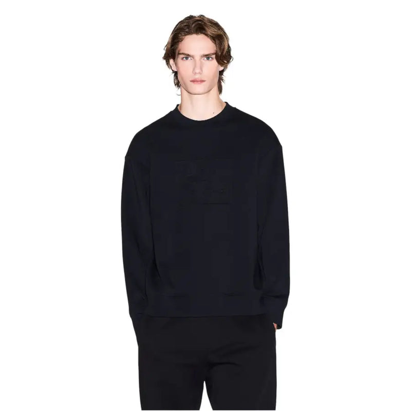 Armani exchange Sweat-shirt oversize en coton noir pour homme, col rond, avec poche avant discrète et coupe décontractée.
