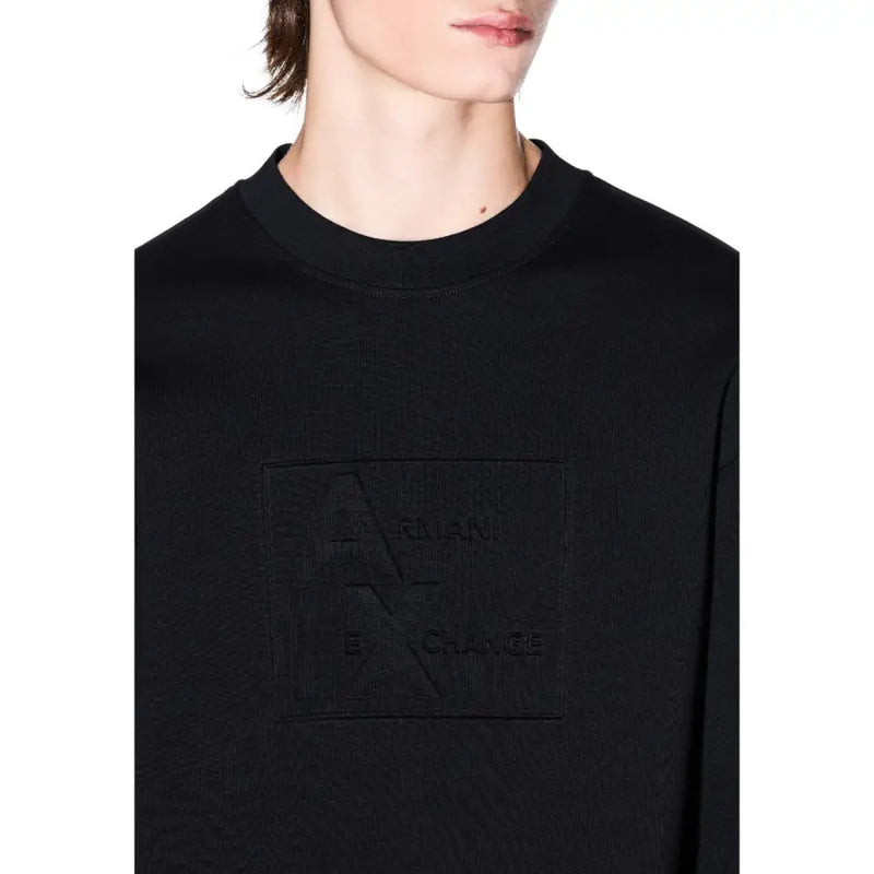 Armani Exchange Sweat-shirt noir en coton pour homme, col rond, avec un logo discret en relief sur la poitrine.