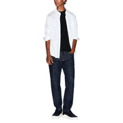 A man wearing an Armani Exchange men black cotton t shirt paired with a white shirt, dark blue jeans, and black sneakers