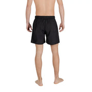 Armani Exchange Short de bain noir pour homme en polyester avec taille élastique et poches latérales, idéal pour le printemps et l'été.