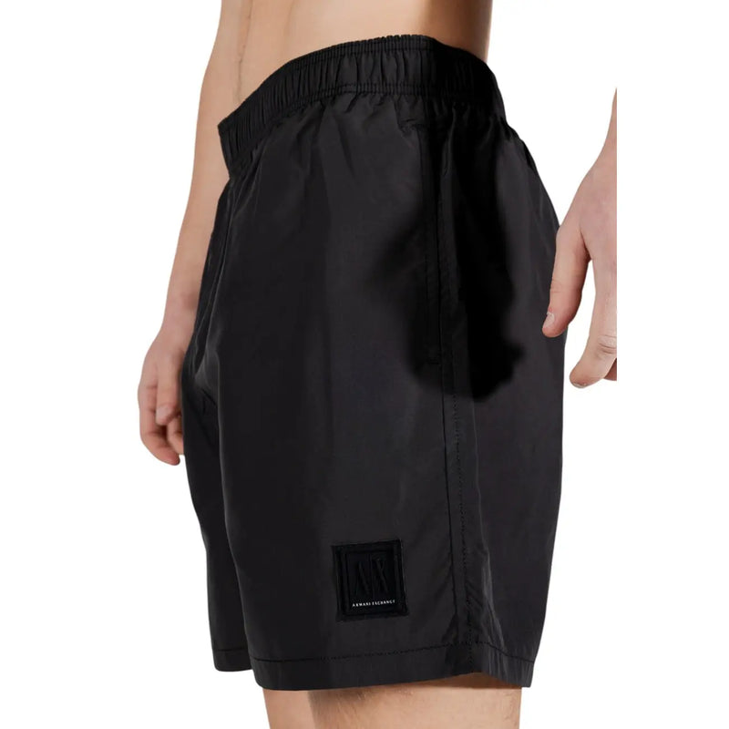 Armani exchange men black polyester swimwear shorts with elastic waistband and subtle logo patch on lower leg