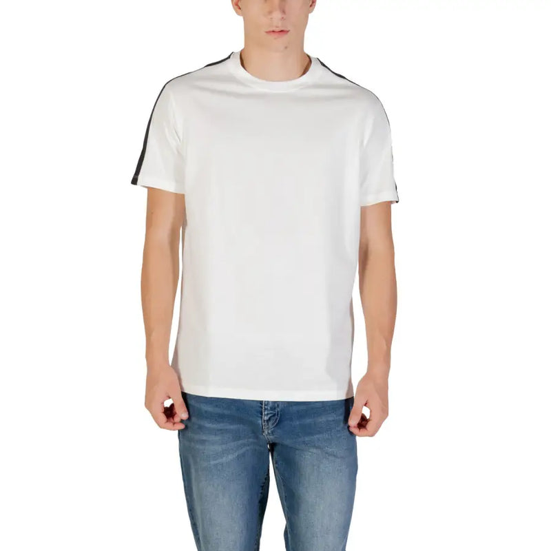 Men’s white crew-neck T-shirt with black shoulder stripes paired with blue jeans