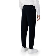 Black tailored trousers with sleek modern cut and subtle side pockets for Armani Exchange men spring summer collection